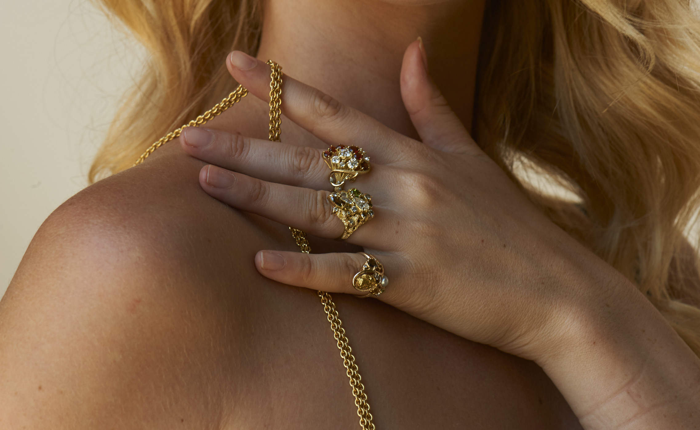 Model wearing a range of Paul Amey handmade rings and pendant