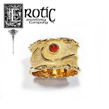 Paul Amey signature molten edge and textured 9ct gold ring with natural garnet.