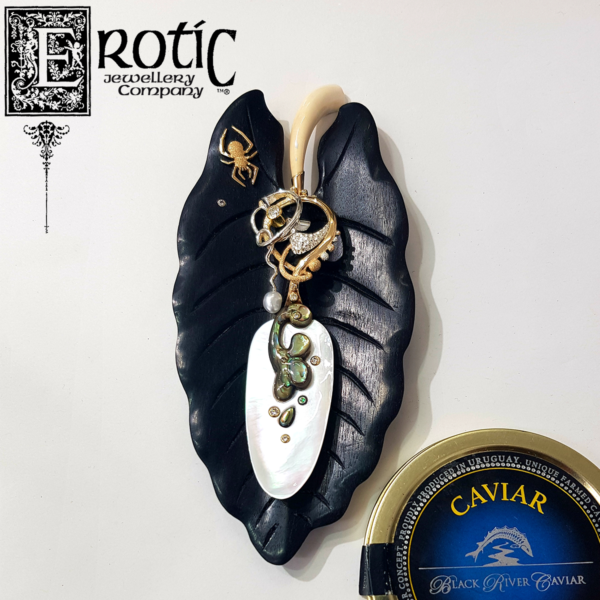 Paul Amey's handmade and carved small caviar spoon in gold mother of pearl and paua on ebony leaf rest with spider