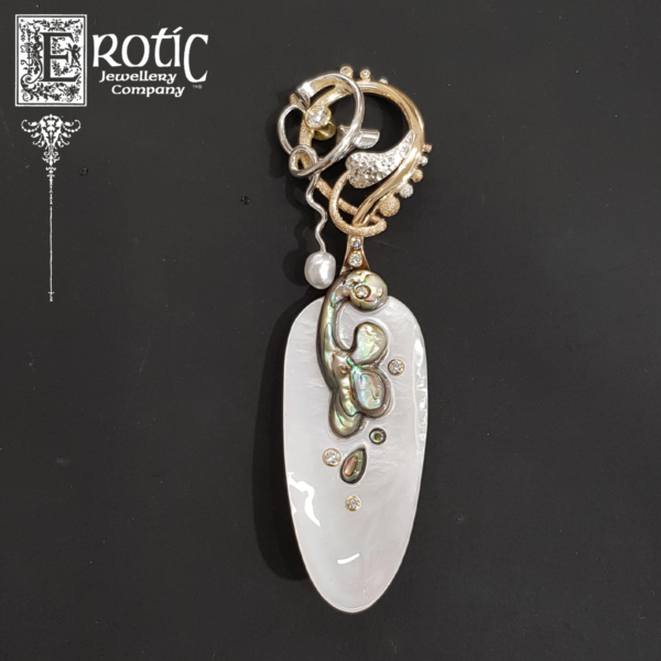 Paul Amey's handmade and carved small caviar spoon in gold mother of pearl and paua