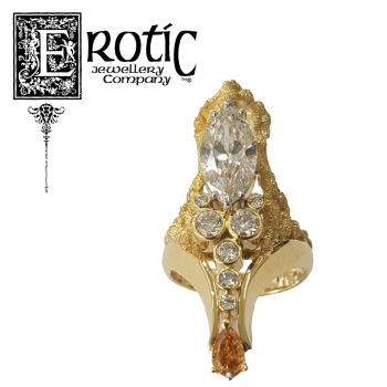 Natural Orange diamond and white diamonds ring handmade by Paul Amey.